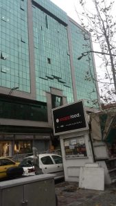 unitized curtain wall vs stick system