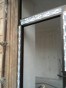 unitized curtain wall vs stick system